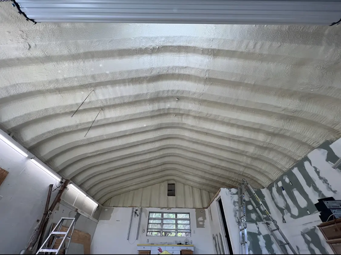 Spray polyurethane foam applied to the underside of a metal roof deck in North Valley